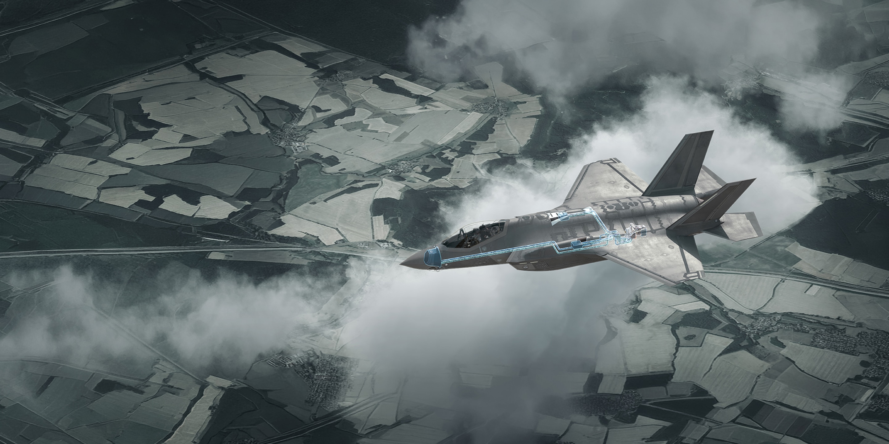 image of an F-35 Lightning II fighter jet flying above clouds and terrain