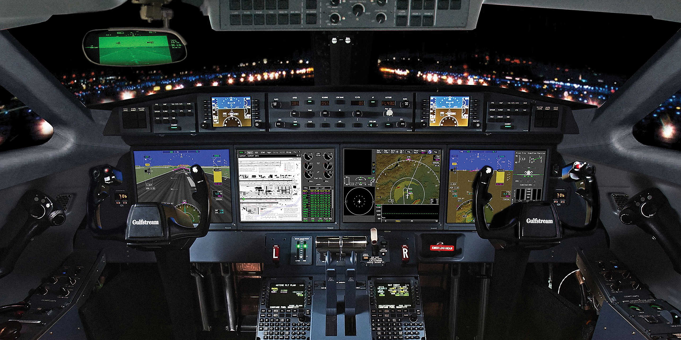 Cockpit of a Gulfstream aircraft featuring illuminated flight displays, dual control yokes, and a runway visible through the window.